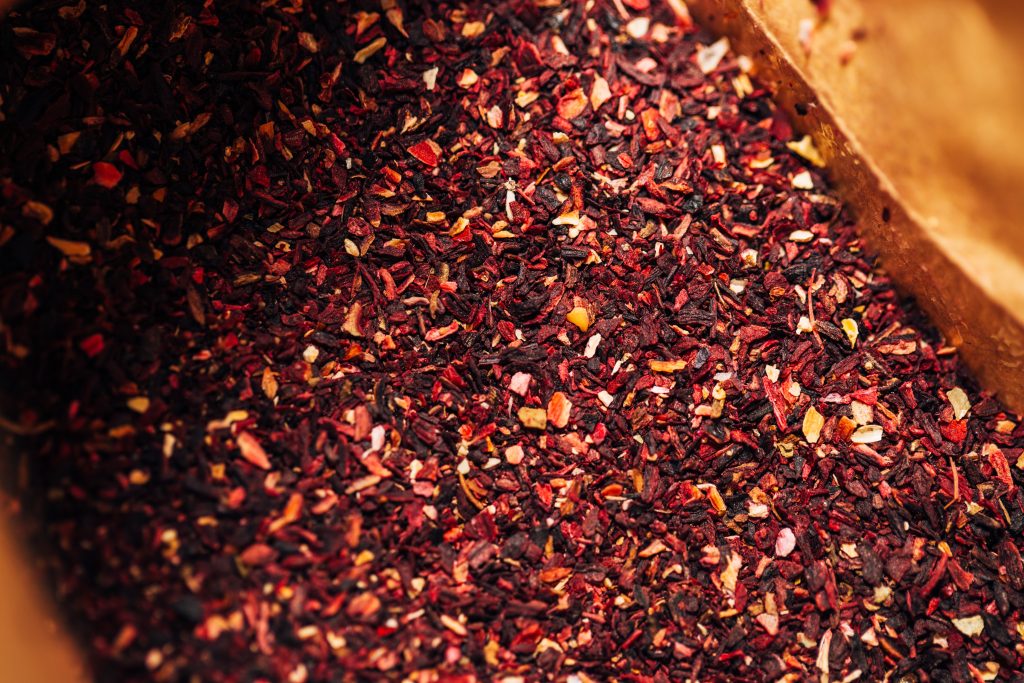 brown and red dried leaves on brown wooden box